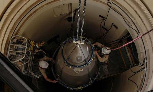 Airmen from the 90th Missile Maintenance Squadron prepare a reentry system for removal from a launch facility
